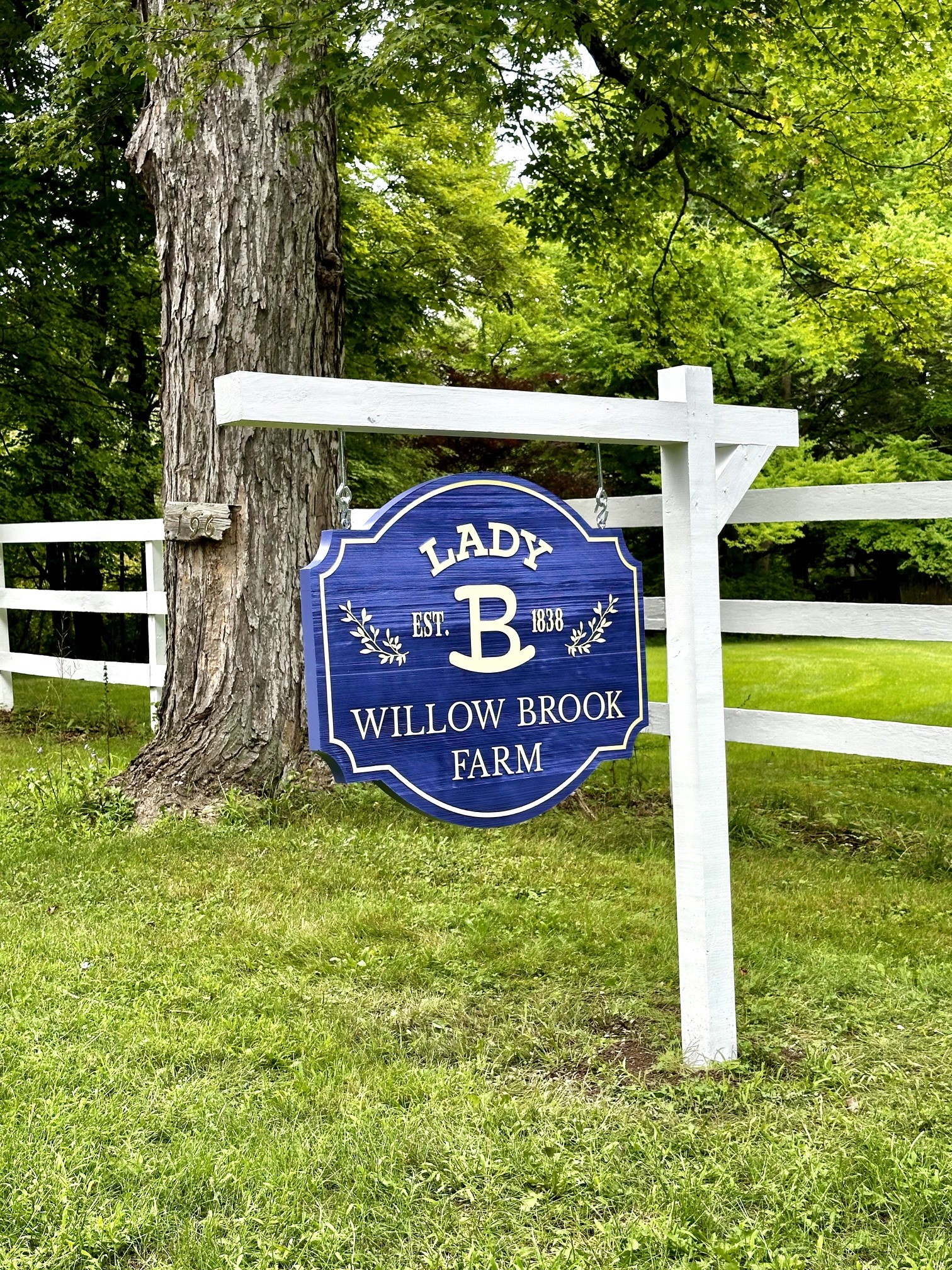 The Lady B Willow Brook Farm entrance sign in summer